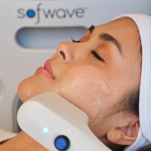 Woman having sofwave treatment on her face